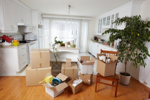 Packed office boxes and furniture ready for relocation