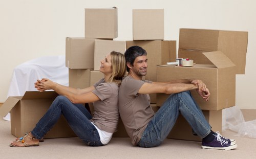 Commercial movers handling desks and equipment in South London