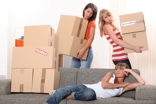 Professional movers handling household items in a South London relocation